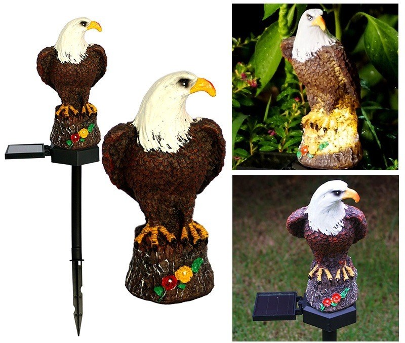 Eagle solar stake light with painted resin eagles and small solar panel.