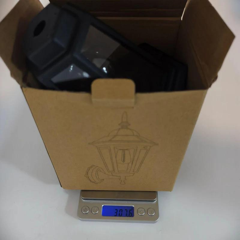 Cardboard shipping box for solar wall sconce lantern with printed lid diagram