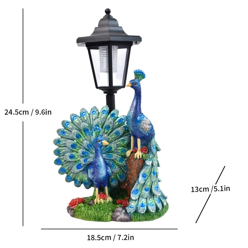 Solar LED lantern garden statue with a blue peacock and fanned tail detail on grass
