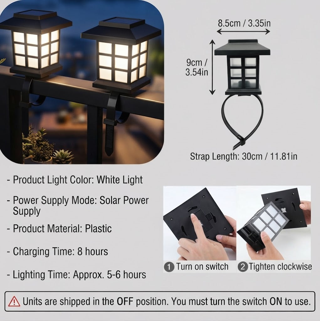 Warm-white solar railing lantern with black housing, strap loop mount, square frosted panels