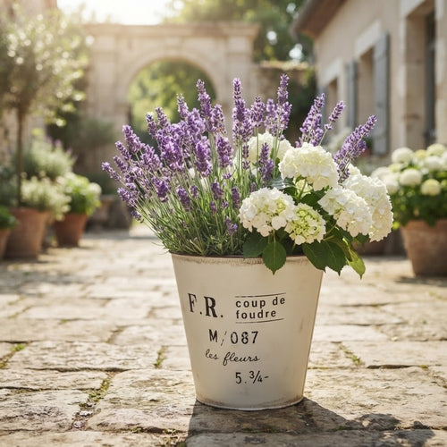Vintage metal planter bucket, cream F.R. French style with purple and white blooms