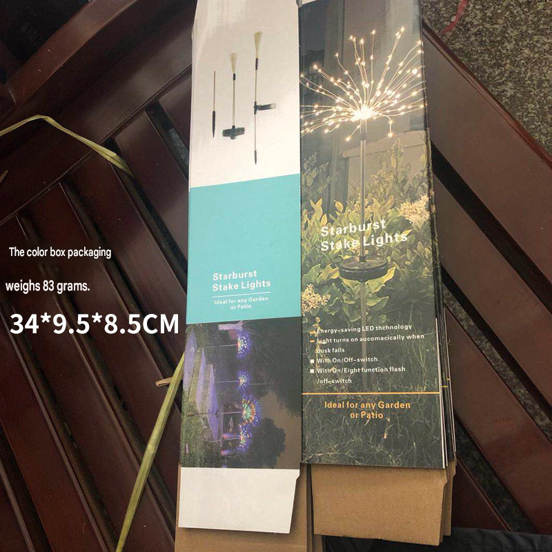 Solar firework stake lights package with product photo of glowing starburst stakes