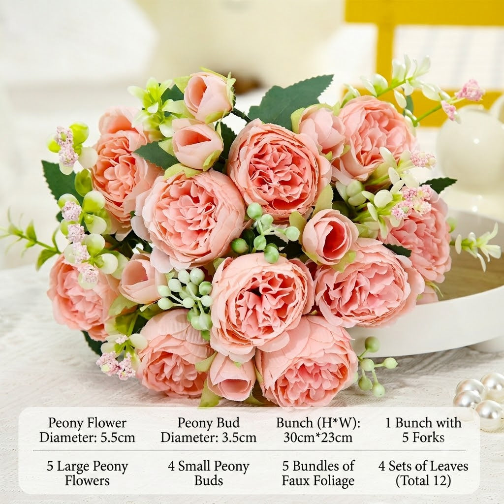 Peach-pink faux peony bouquet with green leaves and small buds in a white pedestal bowl.