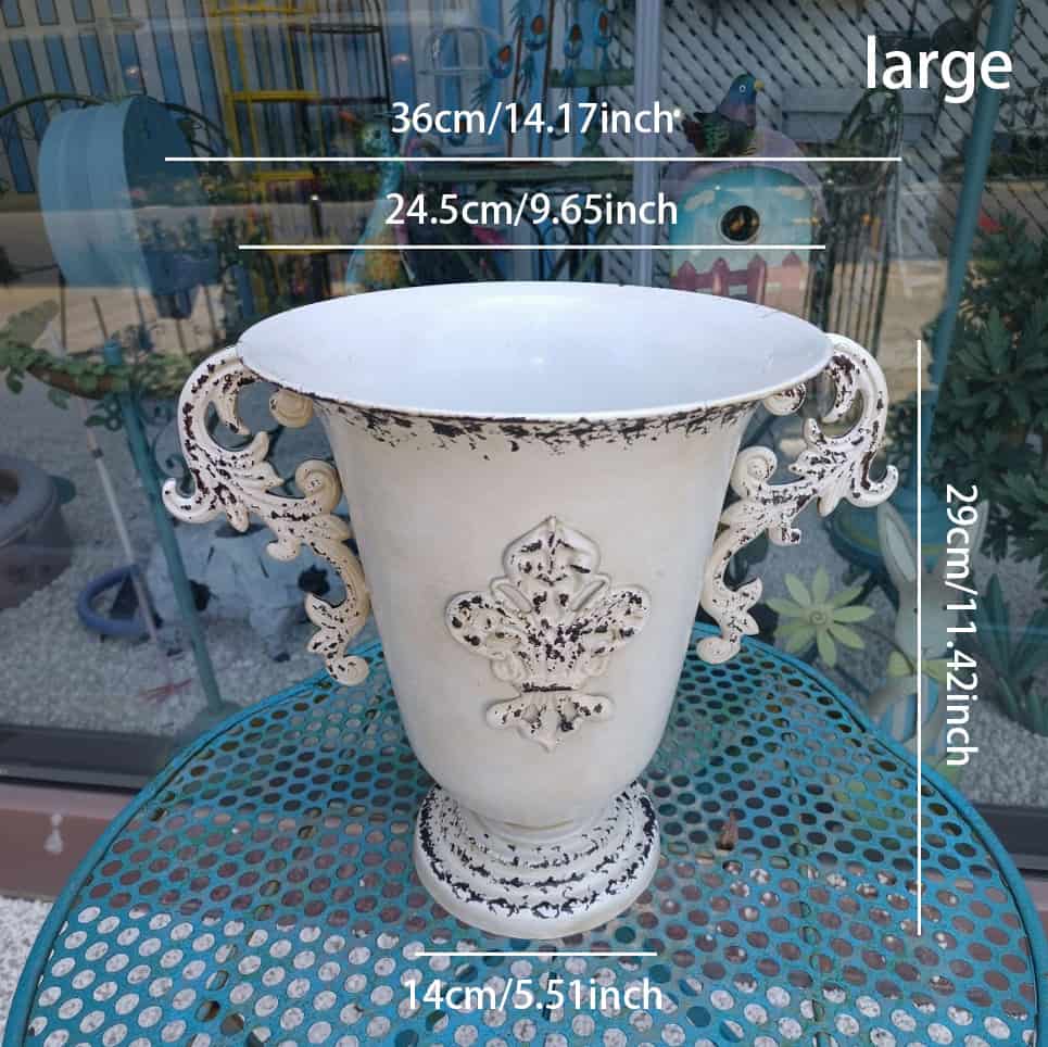 Decorative vase with intricate designs on a table, shown with measurements.