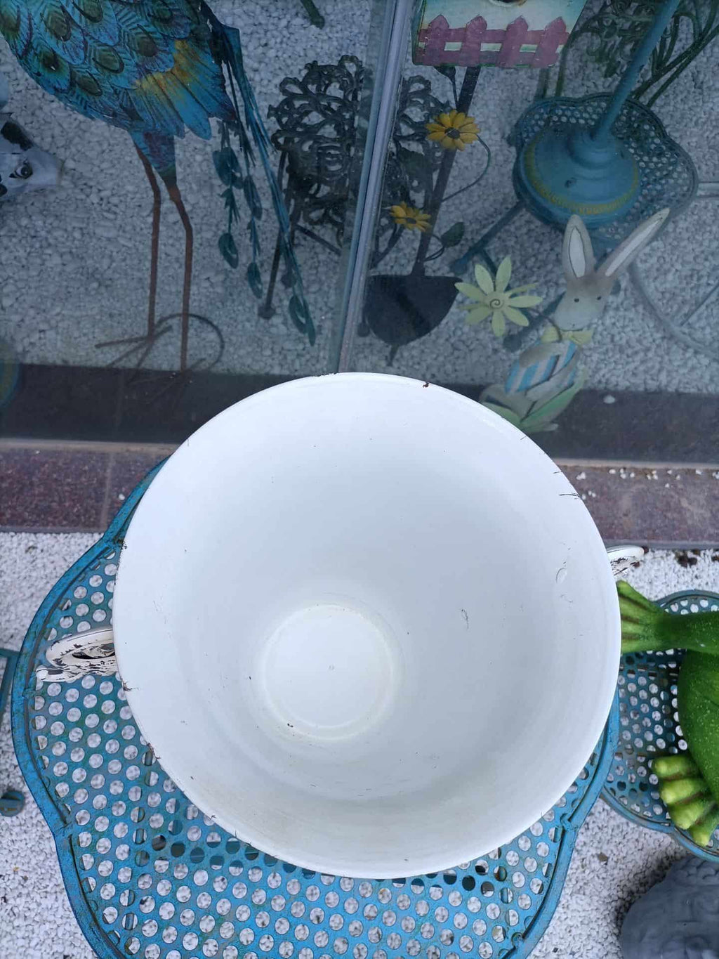 White bowl on a textured surface with decorative elements in the background