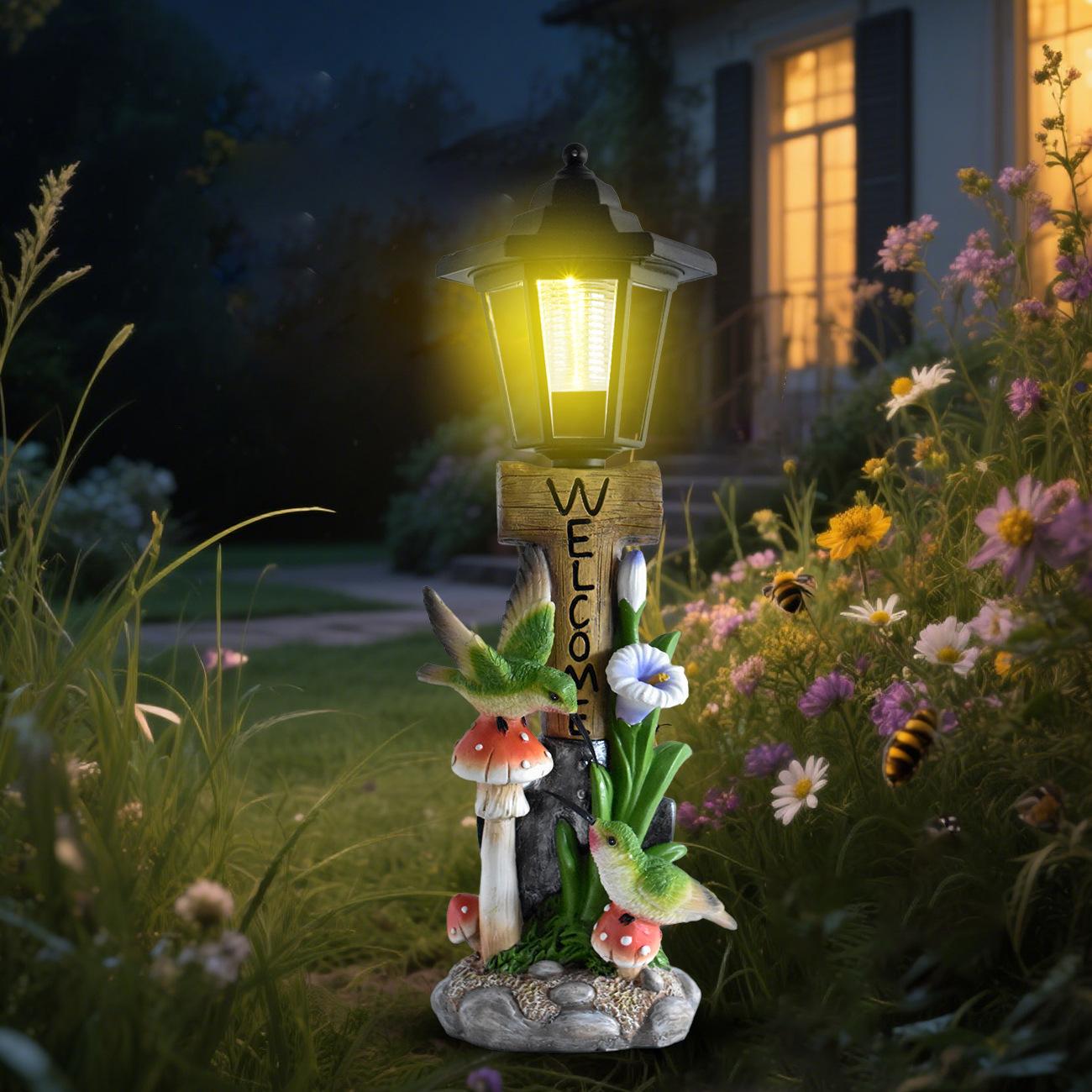 Decorative garden light with fairy elements in a garden setting