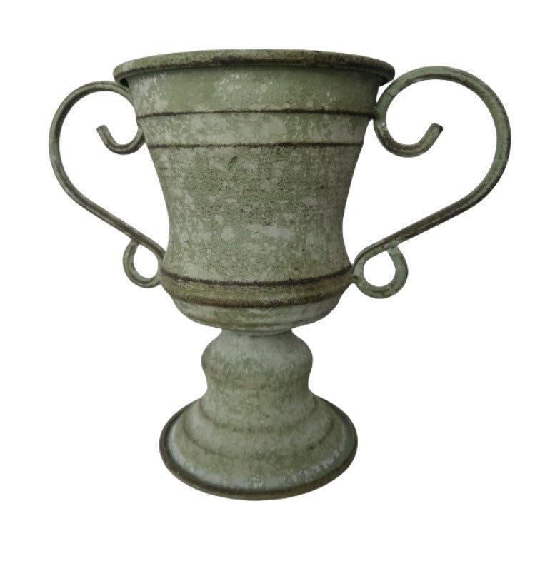 Green distressed metal urn planter with pedestal foot and curved loop handles