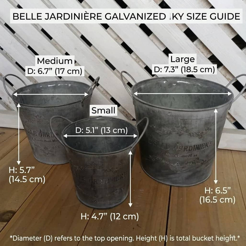Three metal buckets with dimensions labeled on a wooden surface.