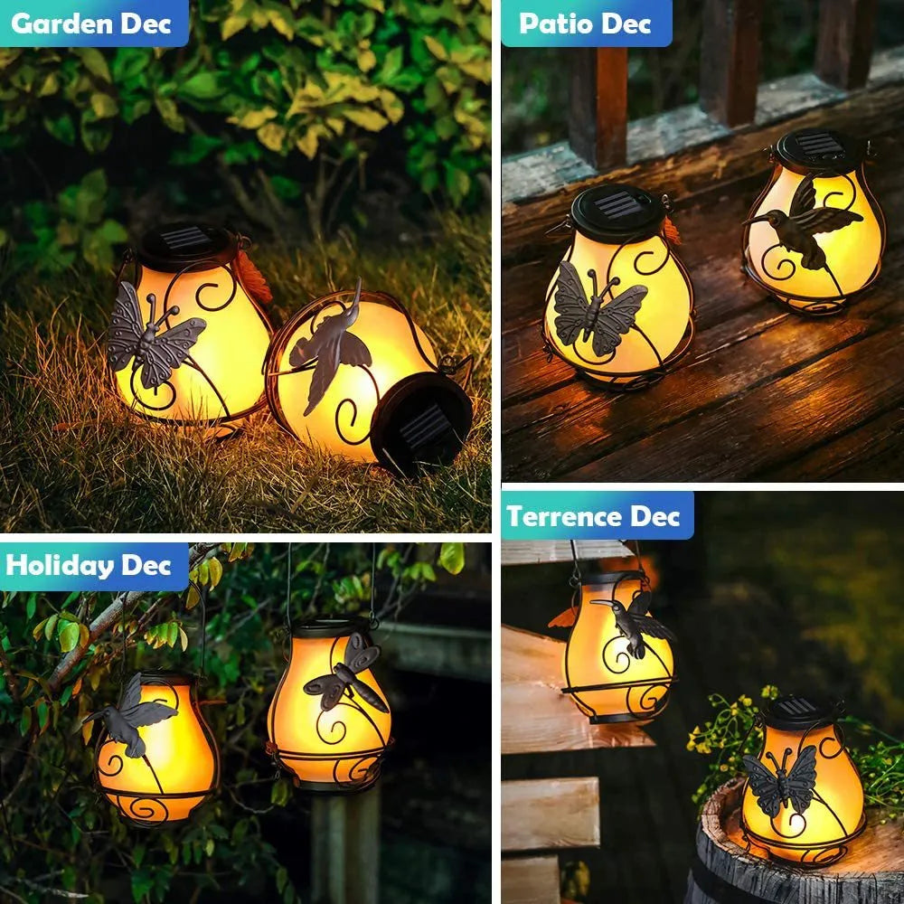 Hanging frosted glass butterfly solar lantern with black metal frame and warm flickering LED