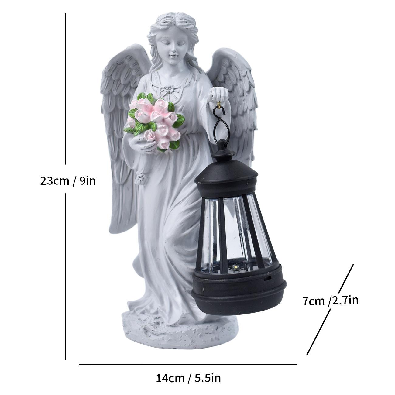 Angel statue with lantern and flowers, showing measurements on a white background