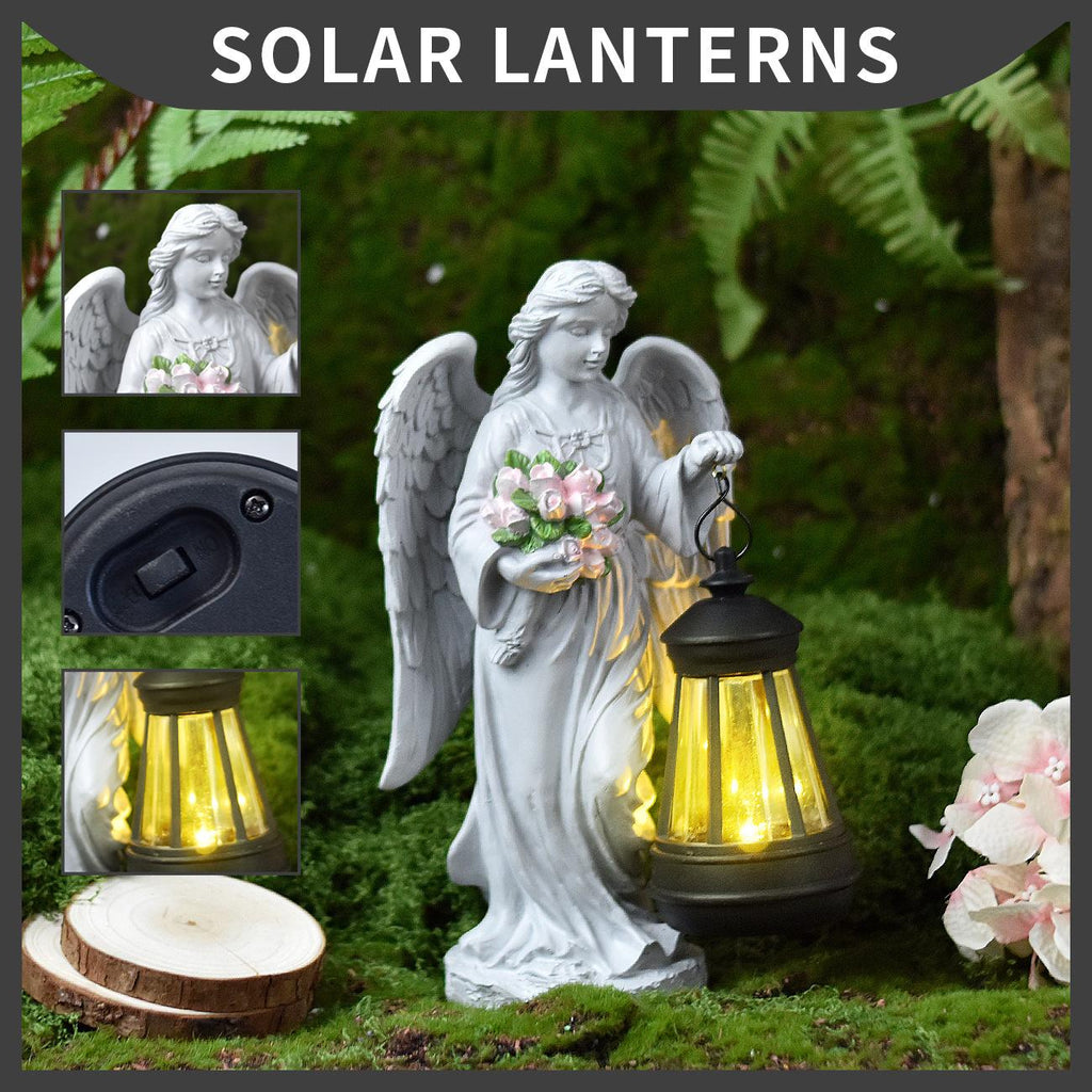 Solar lantern with angel design on grass with close-up details
