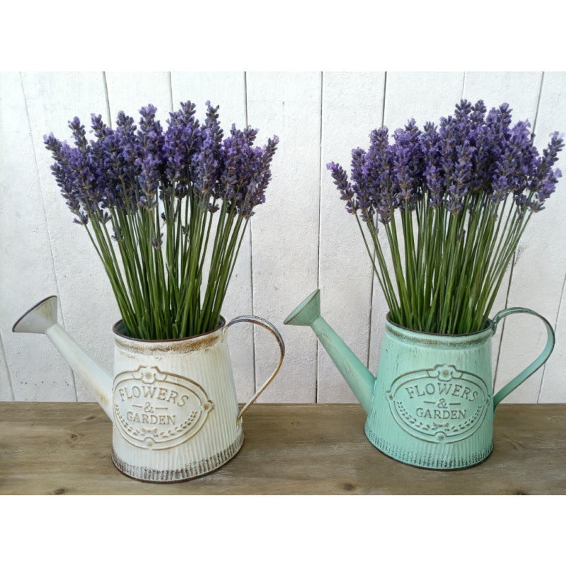 Vintage metal watering can vase set in white and mint-green with purple lavender blooms