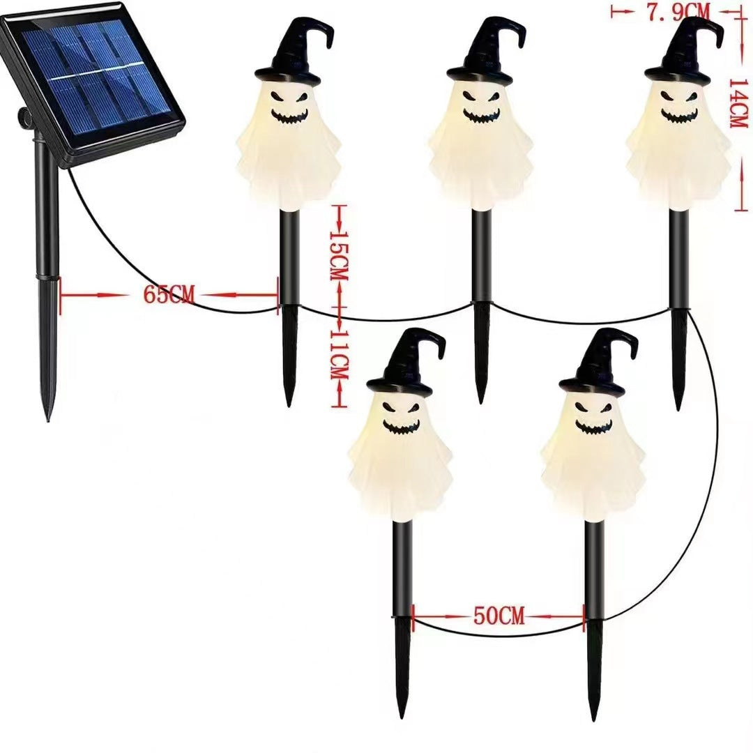 Solcelledrevne LED-spøgelseslamper med solpanel, sorte pæle og lysende hvide spøgelser