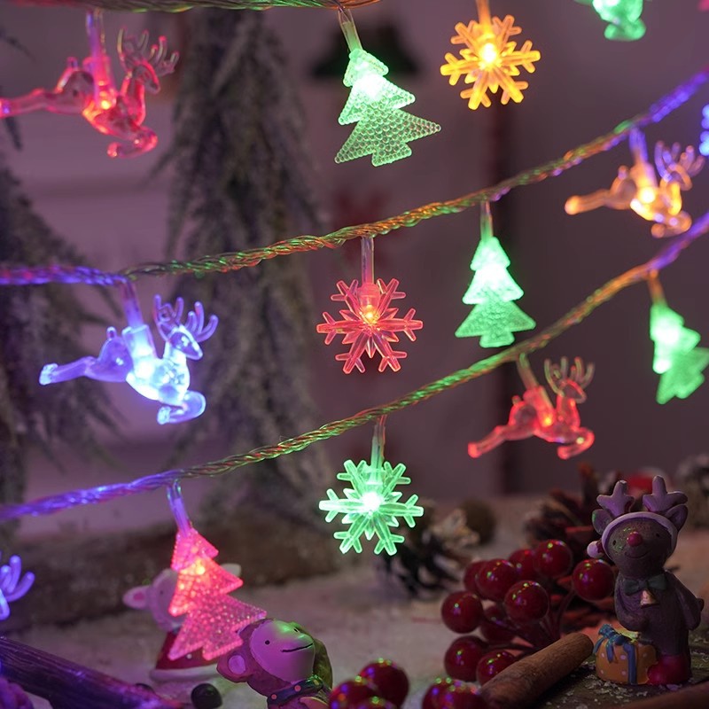 Colorful LED light string with glowing snowflake, tree, and reindeer character ornaments