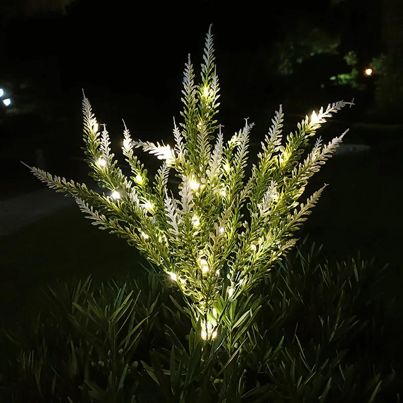 Glowing solar pathway stake lights with lavender-toned tips, set of two