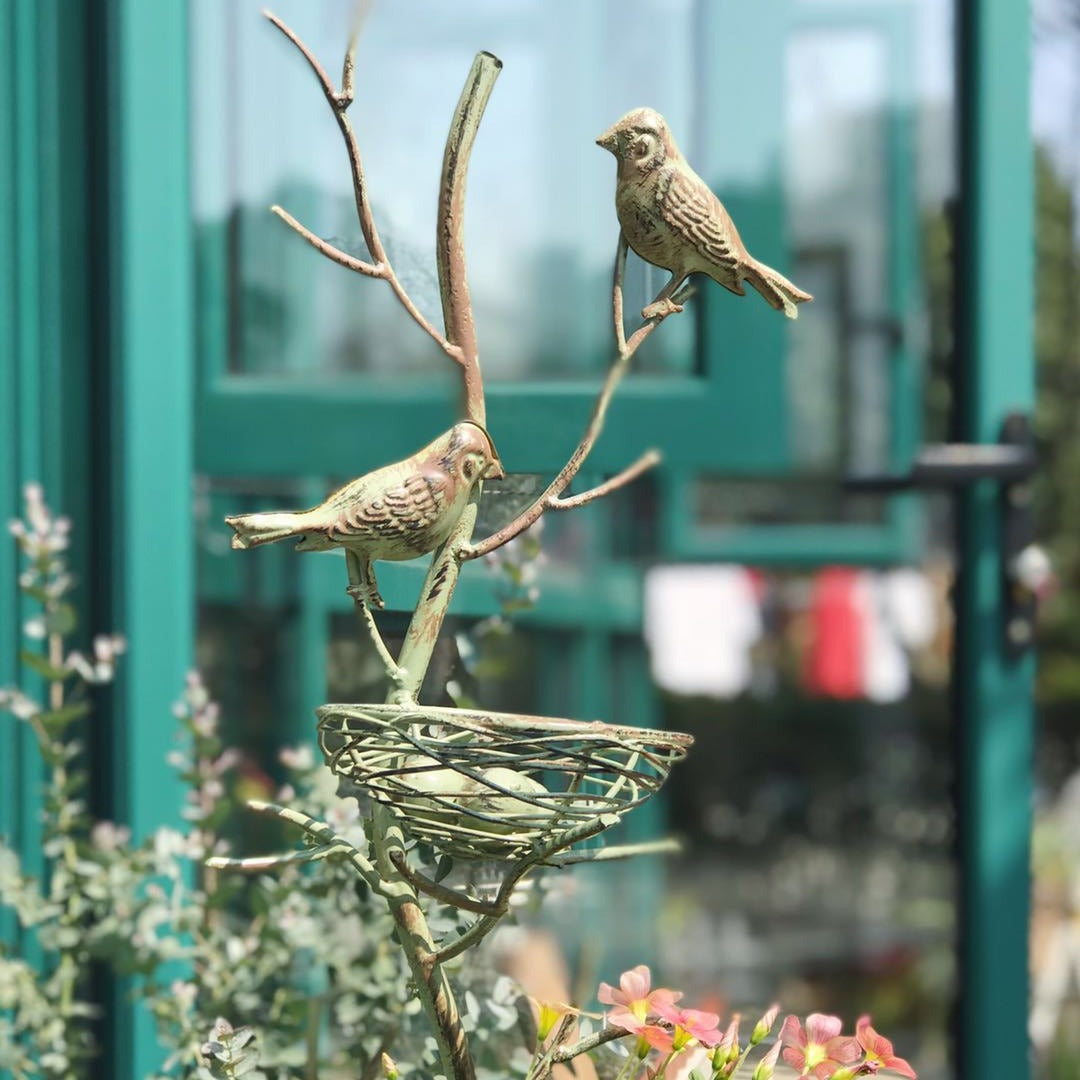 Metal garden stake trellis with vintage bird nest and two perched birds, sage green finish