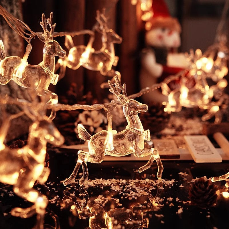 Warm white LED string lights with glowing reindeer outline bulbs
