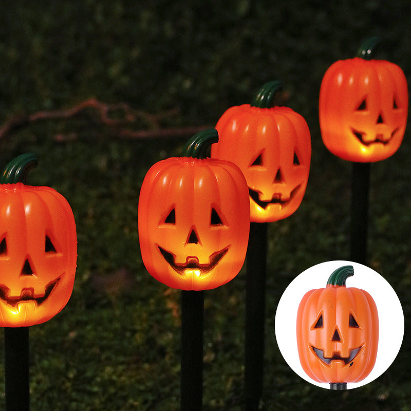 Halloween LED græskarlygter, orange græskaransigter på sorte pæle