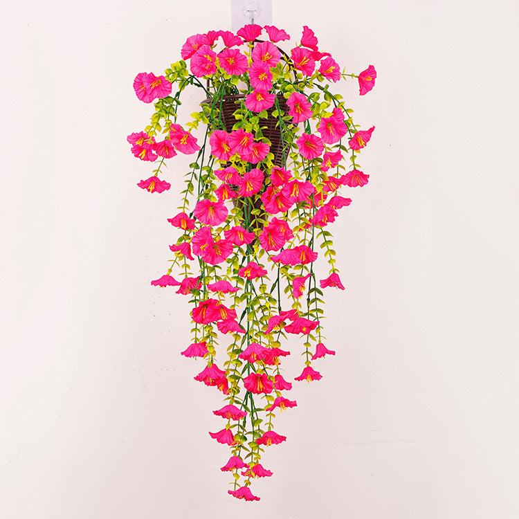 Artificial hanging vine flowers with hot pink blooms and cascading green stems.