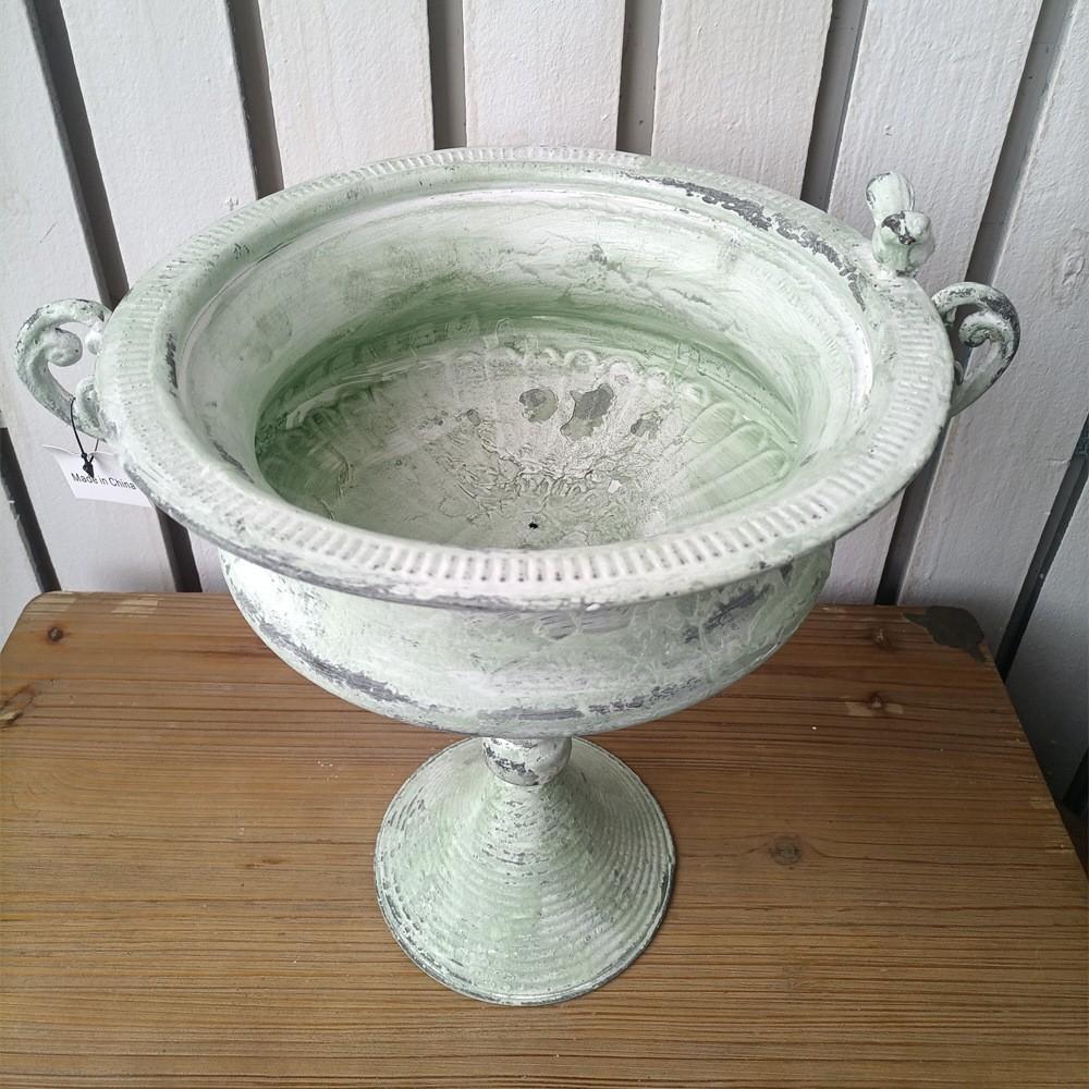 Distressed green planter urn bowl on pedestal base with decorative rim and handles