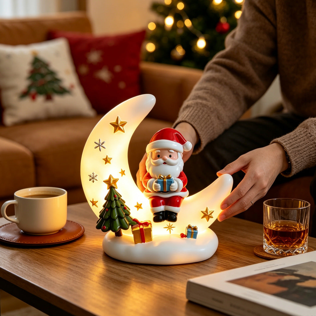 Lámpara de noche de luna de Papá Noel sobre la mesa del salón con luz cálida