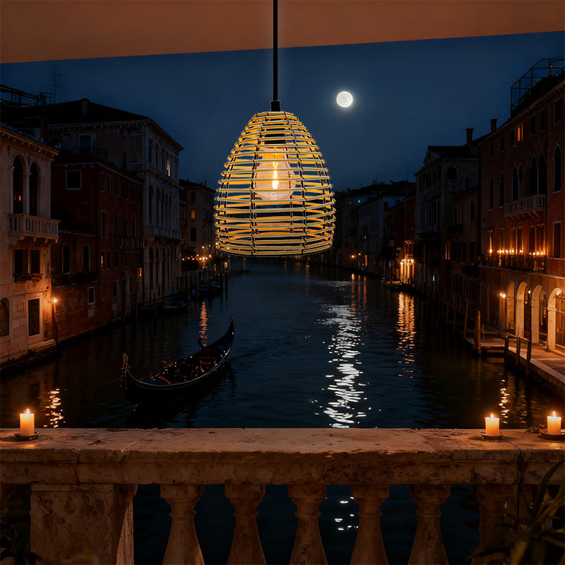 Rattan pendant lantern light hanging over a night canal scene
