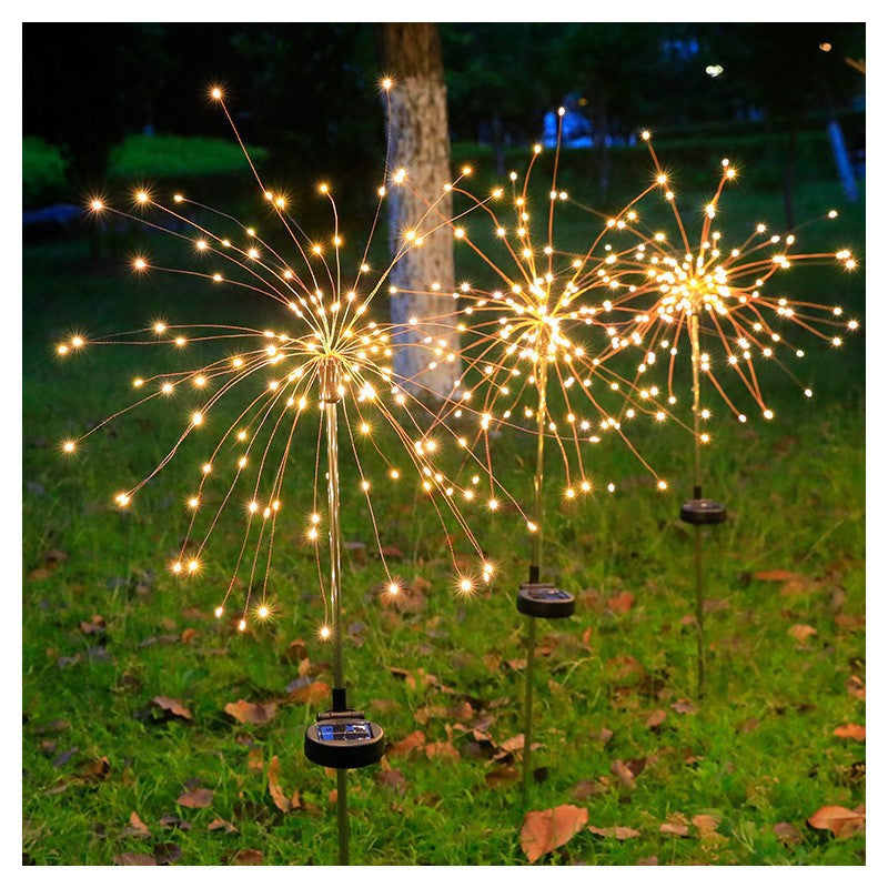 LED solar firework stake lights glowing warm white gold starburst beams
