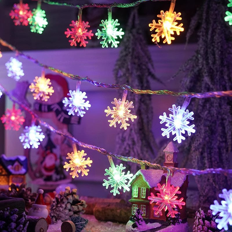 Colorful LED light string with glowing snowflake and tree character ornaments