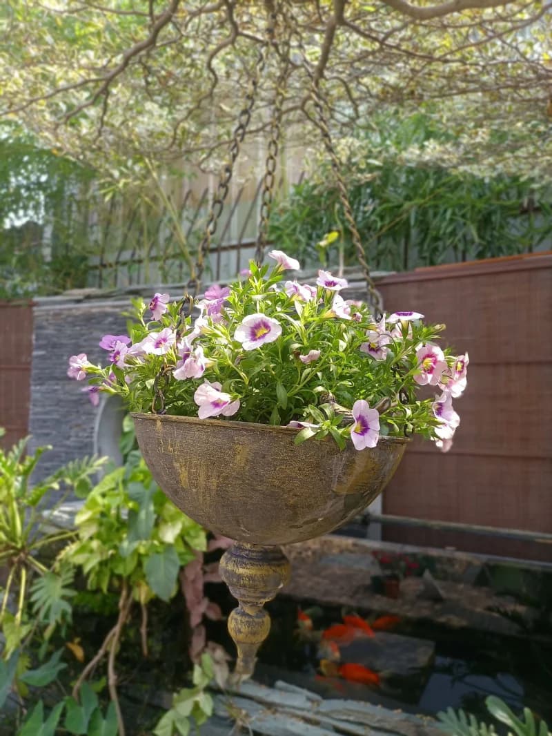 Decorative urn with flowers in a garden setting