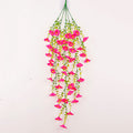 Hanging artificial morning glory vine with bright pink flowers and trailing green leaves