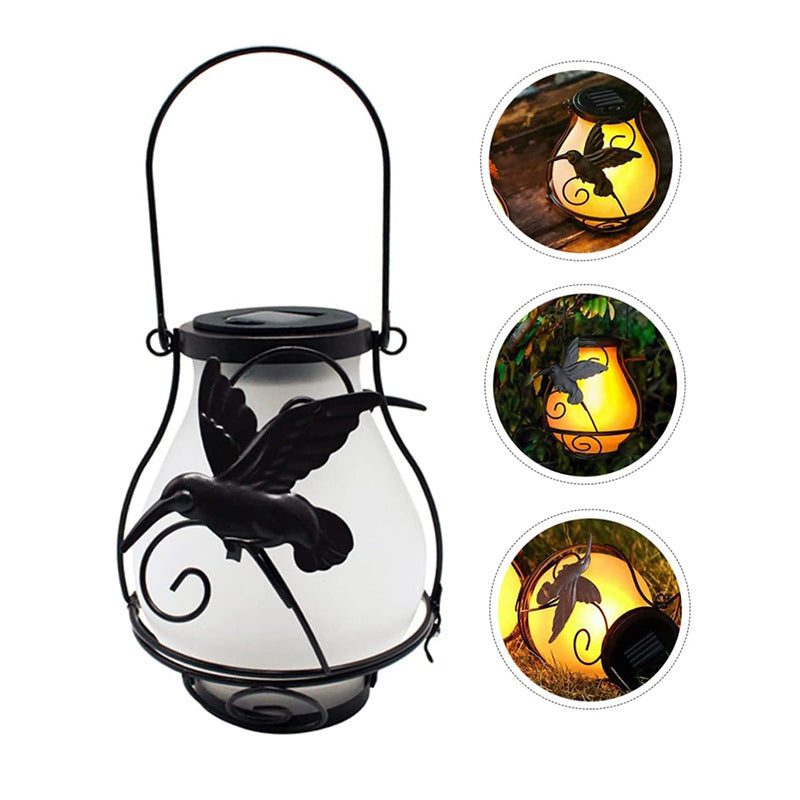 Frosted solar flame lantern with hanging handle and bird cutout, black metal frame