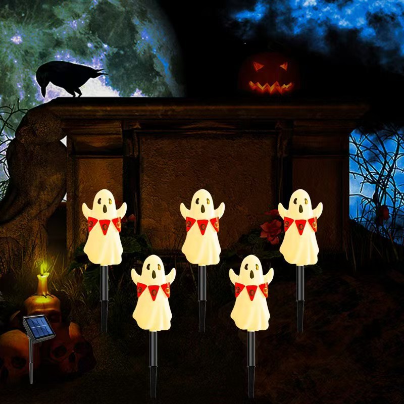 Halloween LED ghost stake lights, glowing white ghost shapes on black stakes