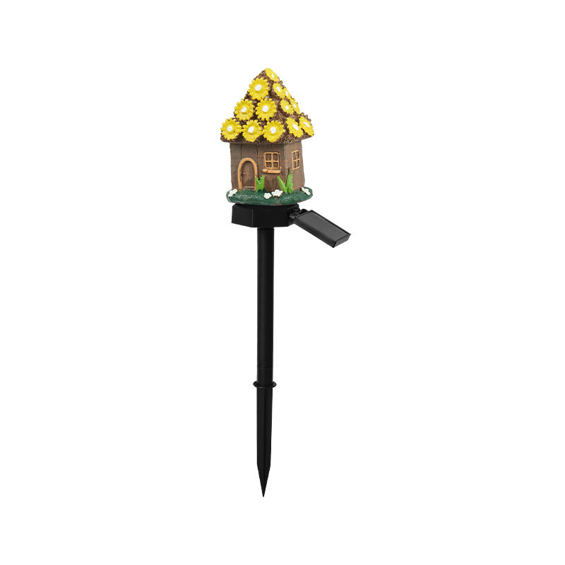 Solar fairy house garden stake with yellow flower roof and small window