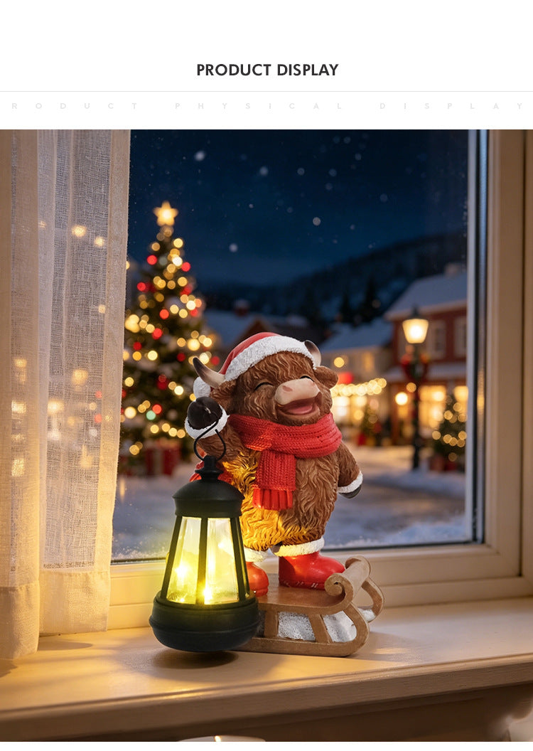 Cow Christmas solar lantern statue on window ledge with glowing lantern and red scarf