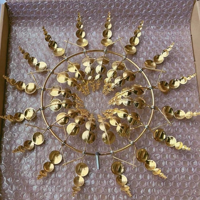 Gold metal sunburst wind spinner garden stake with rotating circular disc