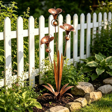 Rustic metal garden stake with three copper bell flowers and curved leaf accents