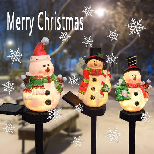 Solar Christmas snowman and Santa light-up pathway stake set with three figures.