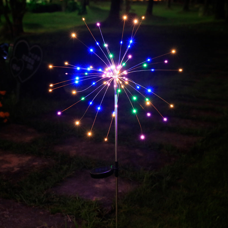 LED solar firework stake light glowing multicolor blue starburst with thin light spokes