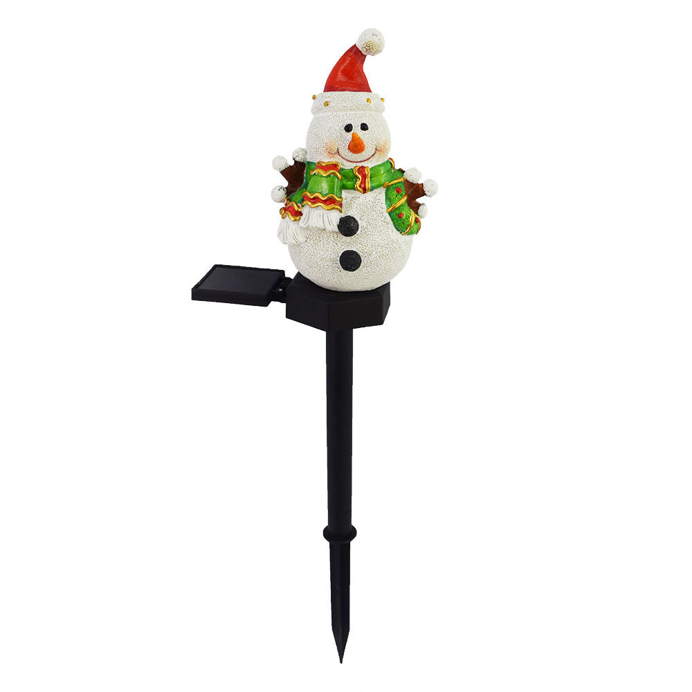 Solar Christmas snowman light-up pathway stake with white body and orange nose.