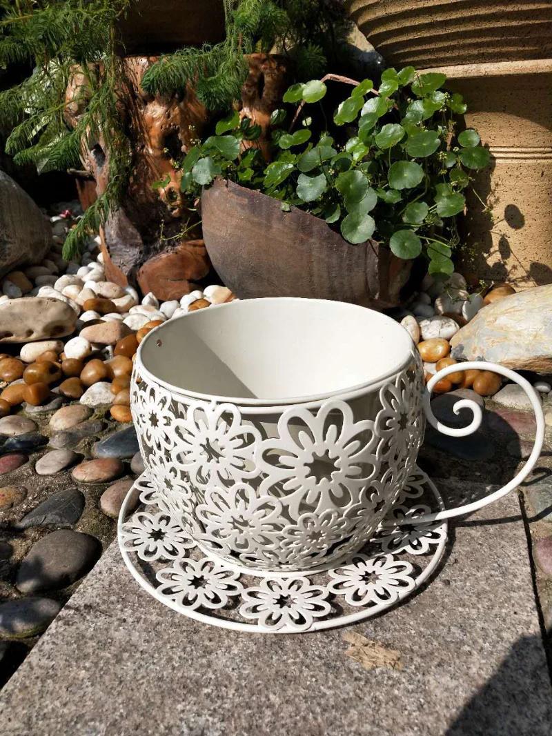 Vintage Floral Cutout Metal Teacup Planter – Rustic Iron Cachepot with Saucer Base & Scrolled Handle (11" Wide) - The Curated Shop