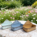 Three metal wall planters with distressed finish, pastel blue and beige tones