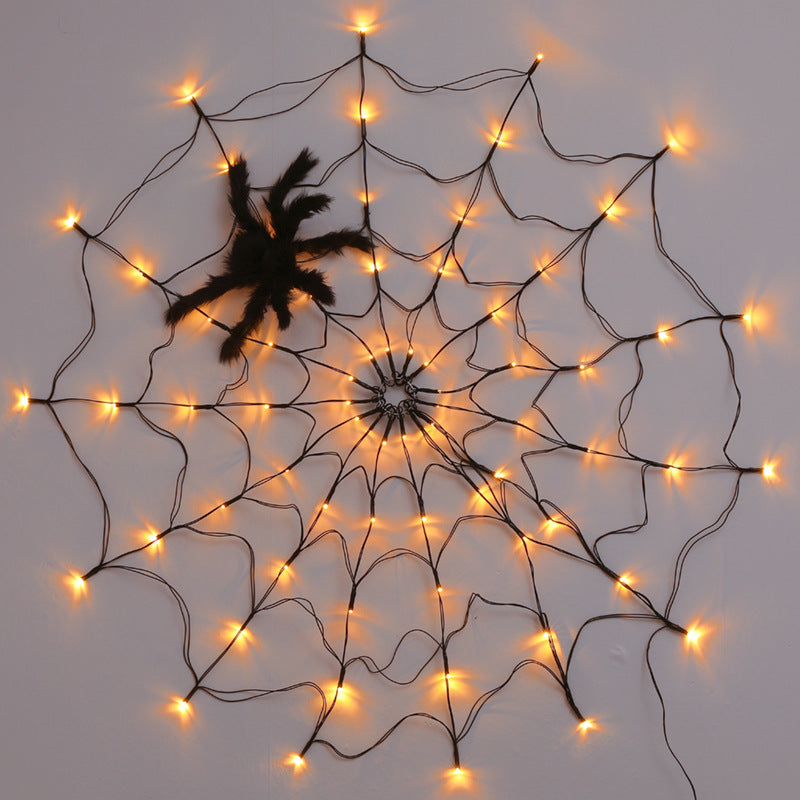 Decoración gigante de telaraña LED con luces de brillo blanco cálido y araña negra.