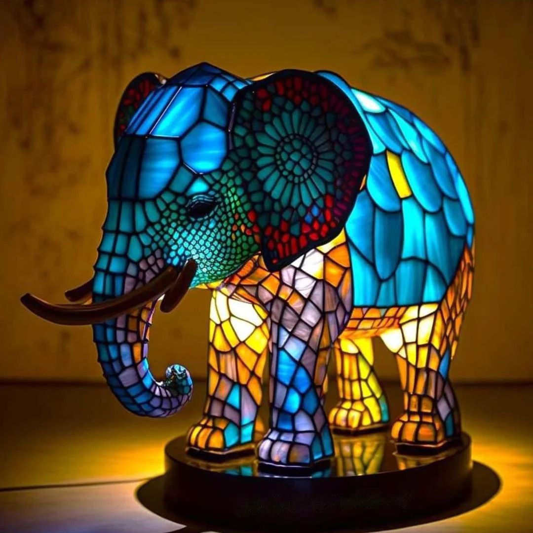 Elephant mosaic resin LED garden light with blue and multicolor stained-glass body on round base
