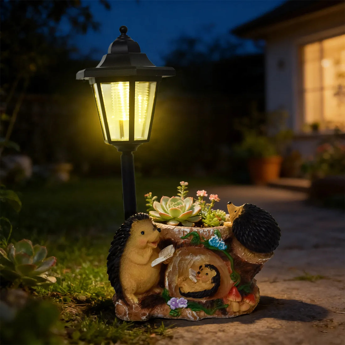 Hand-painted resin hedgehog family garden statue with glowing black LED lantern overhead.