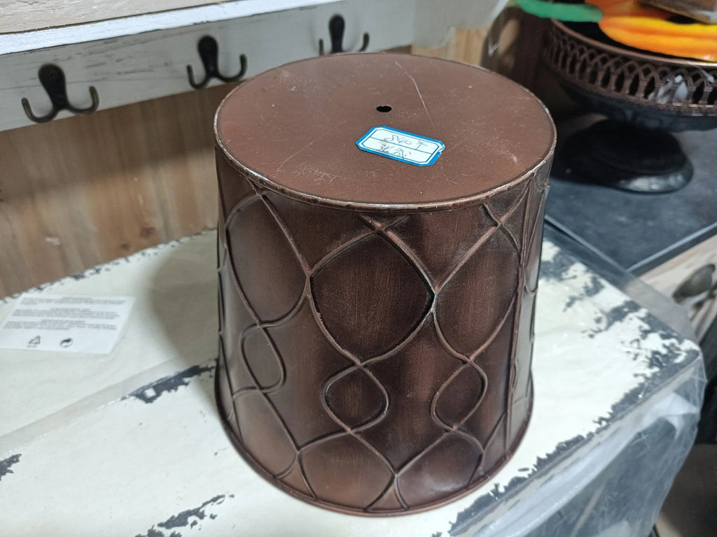 Brown embossed iron planter bucket with round top and diamond pattern, side view