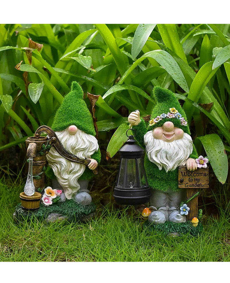 Green-hat resin garden gnome with glowing LED black lantern and welcome sign.