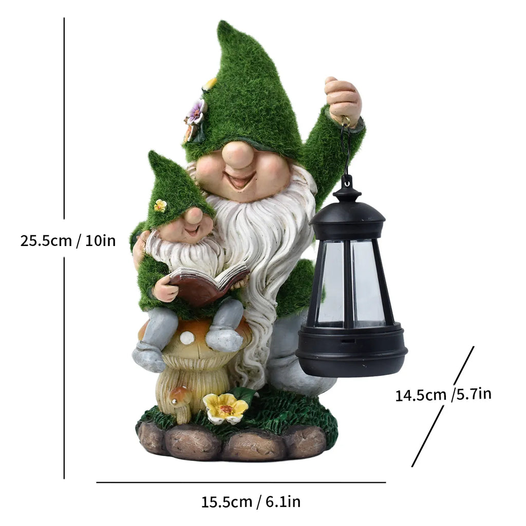 Resin gnome reading in green clothes holding a black solar lantern