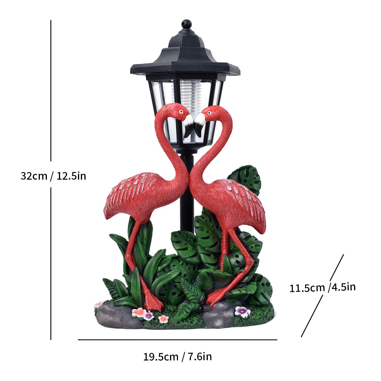 Solar lamp with flamingo design and measurements on a white background