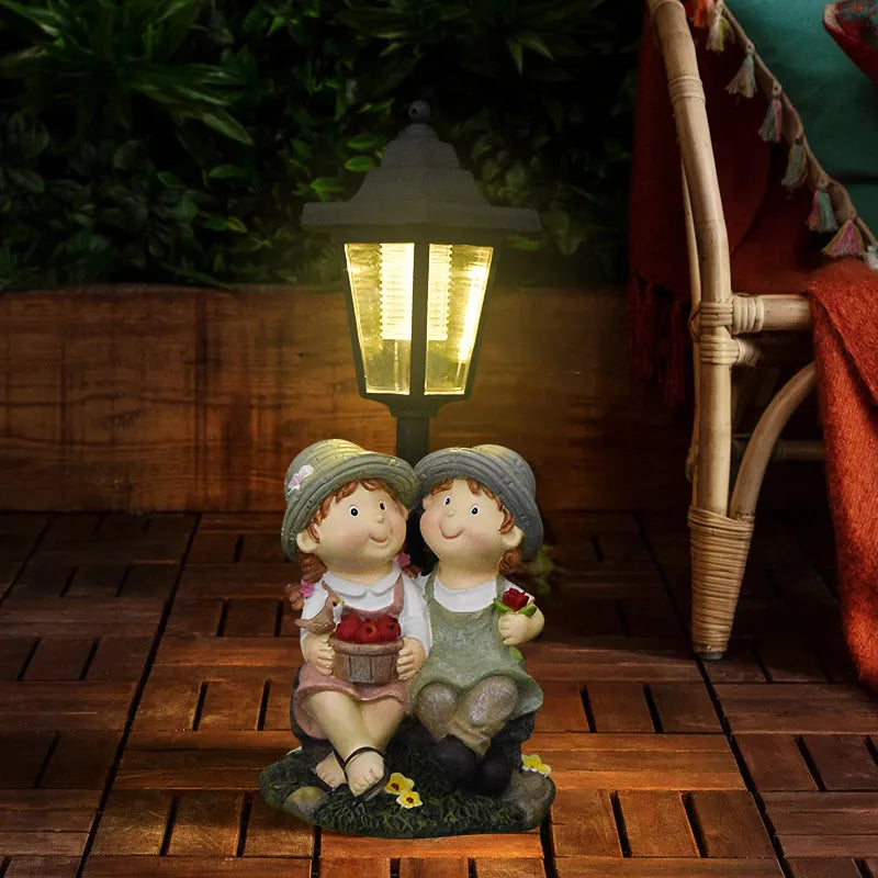 Hand-painted resin couple angel statue with LED lantern, two kneeling cherubs holding flowers