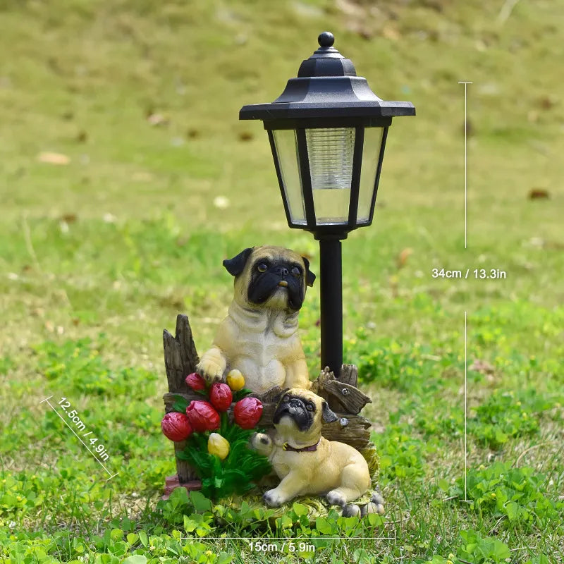 Solar dog garden statue with LED lantern, pug-like dogs on mossy flower base